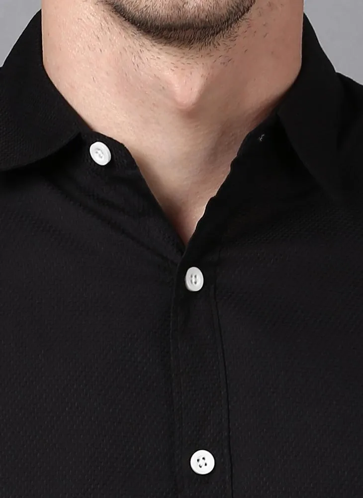 Black shirt with white buttons