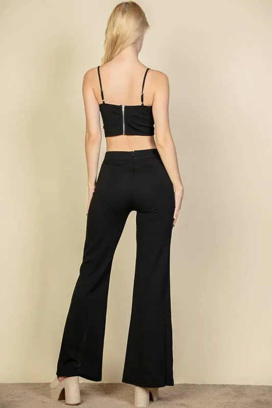 Crop top and wide leg pants with front slit.