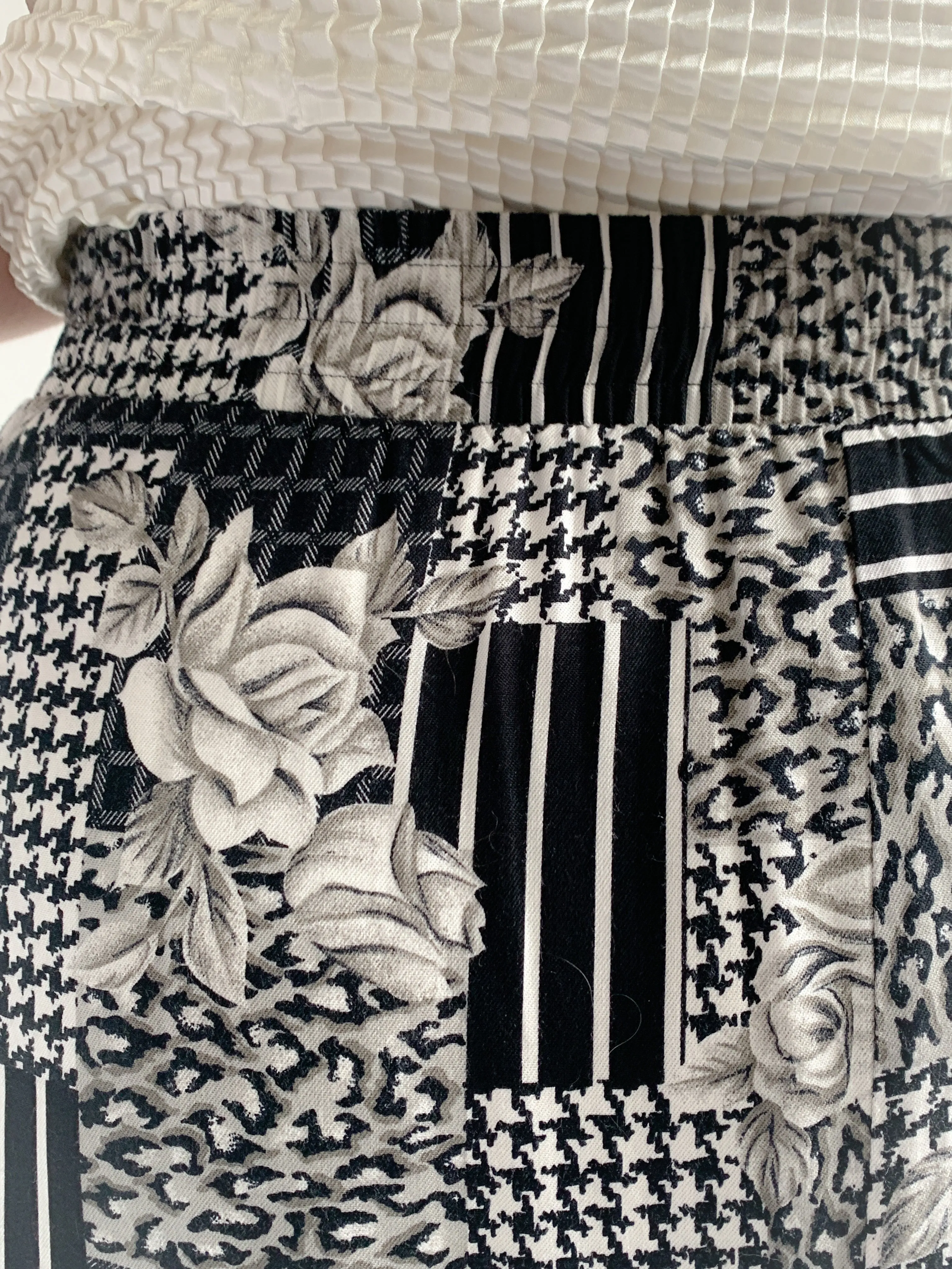 Panther black and white mixed print rayon midi skirt.