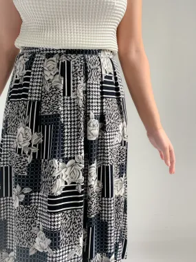 Panther black and white mixed print rayon midi skirt.