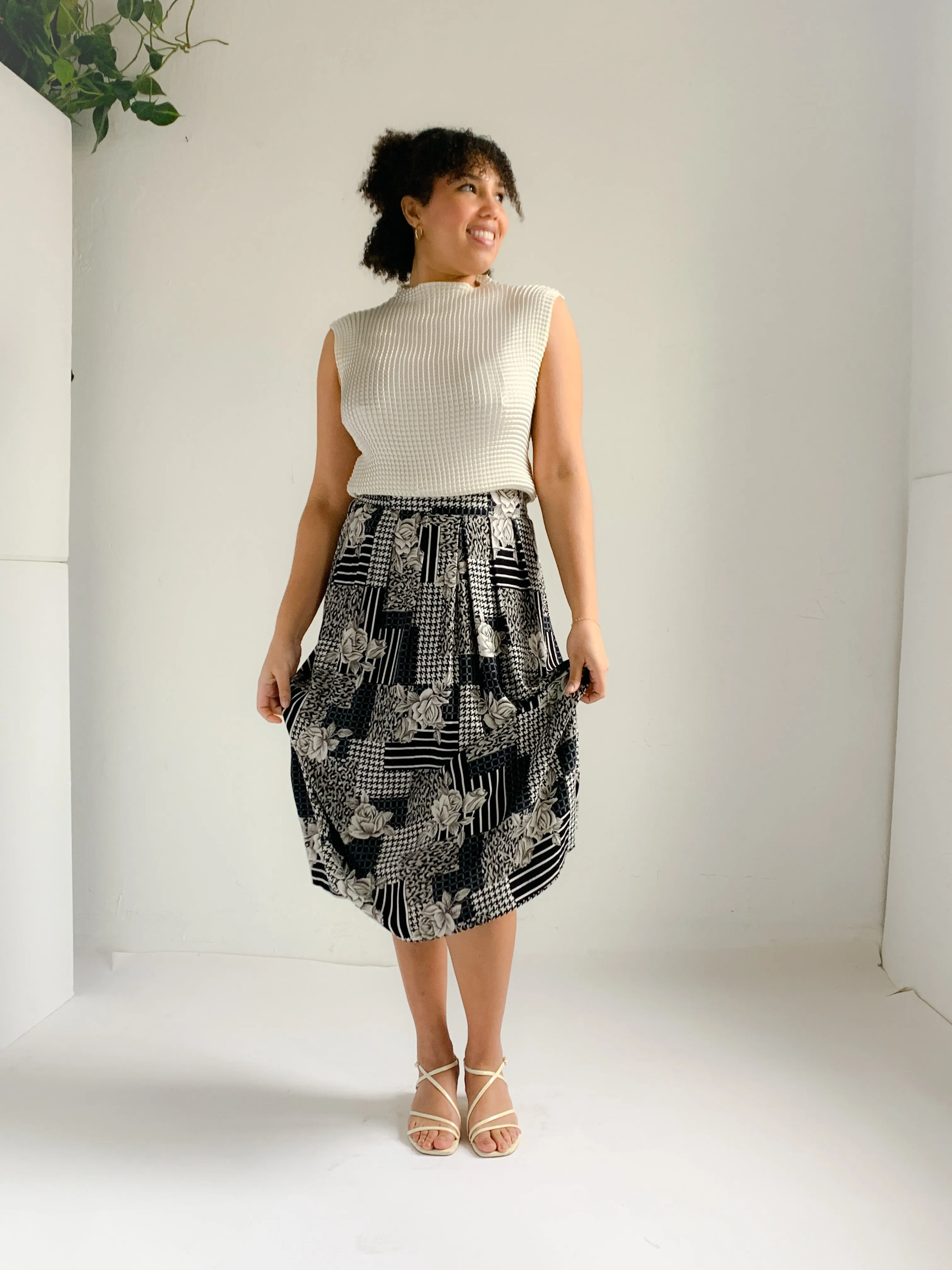 Panther black and white mixed print rayon midi skirt.