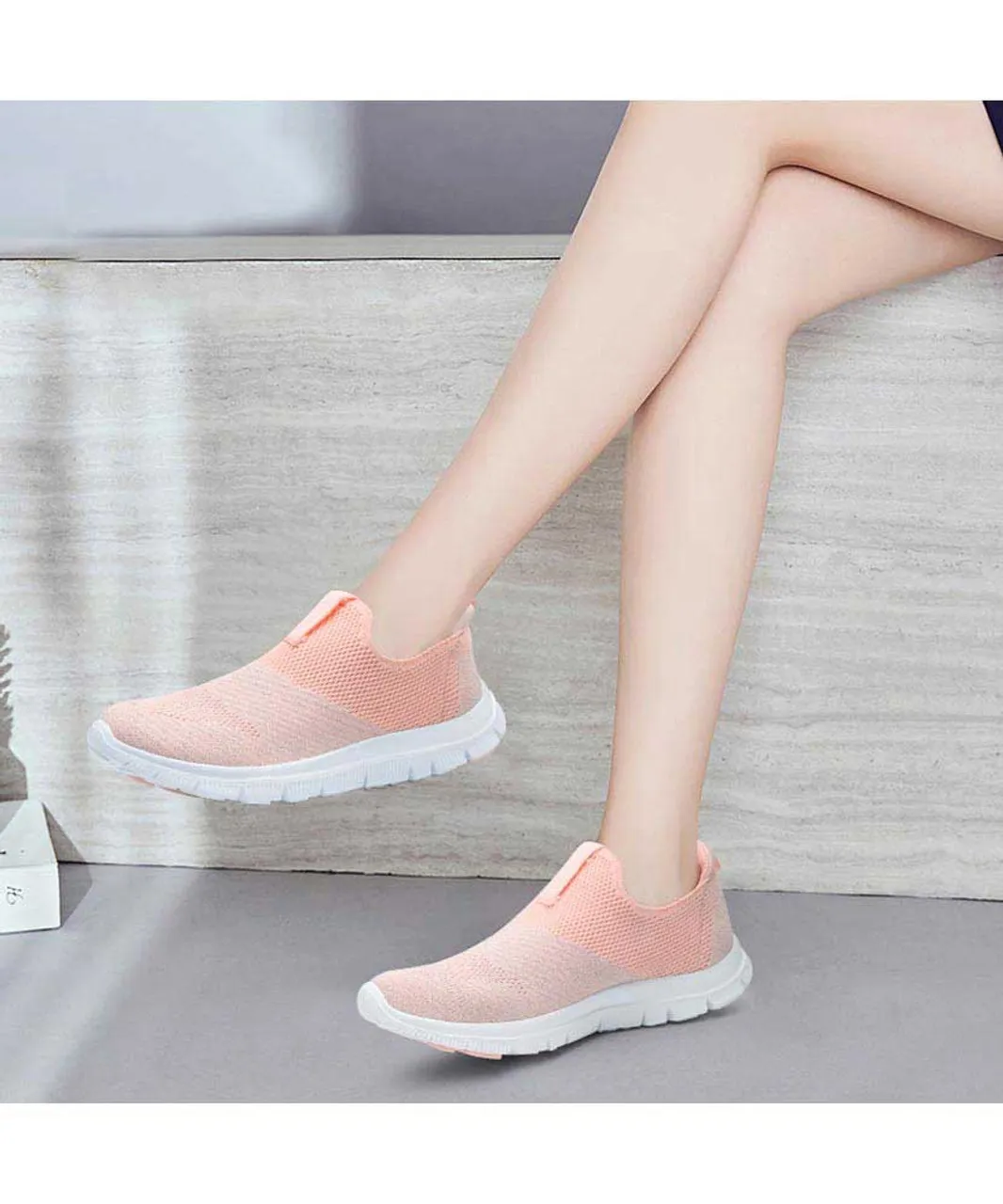 Pink flyknit slip on shoe sneaker