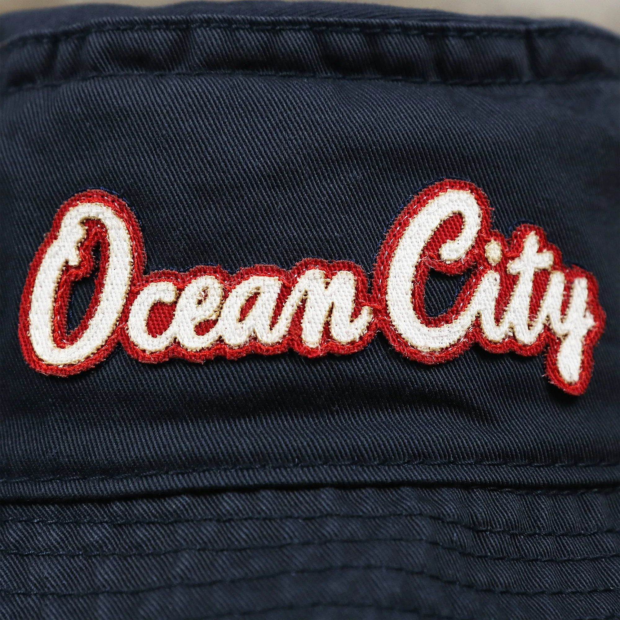 White OCNJ Double Wordmark Red Outline Bucket Hat for Sale | Navy Bucket Hat on Sale in OCNJ