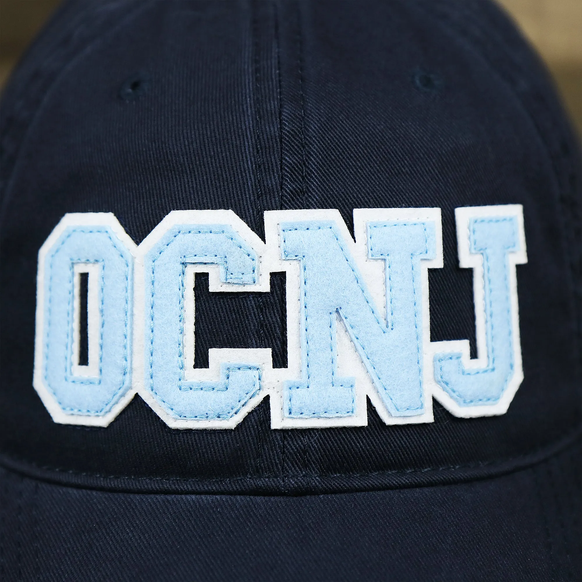 Youth Light Blue OCNJ Wordmark White Outline Baseball Cap